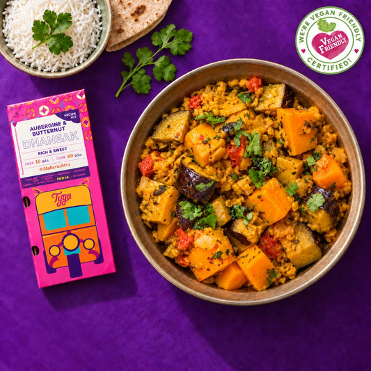 Tyga Aubergine and Butternut Squash Dhansak recipe kit with a bowl of chunky dhansak